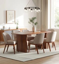 a dining room table with chairs around it