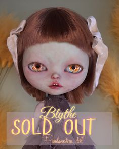 a doll with red hair and blue eyes wearing a dress that says, buy the sold out