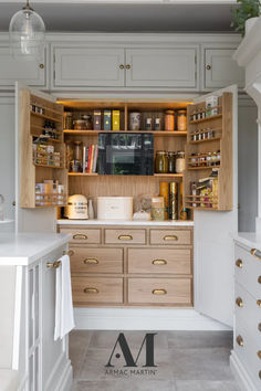 a kitchen with lots of cabinets and drawers