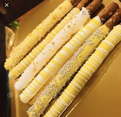 four different types of candy sticks on a plate