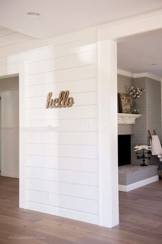 the interior of a house with white walls and wood floors