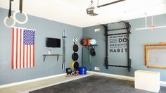 a garage with an american flag hanging on the wall and other things in the room