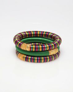 three multicolored bracelets on white background