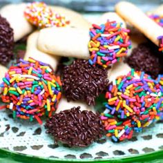 there are many cookies with sprinkles on the plate