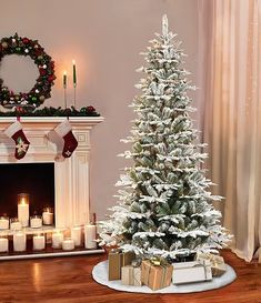 a decorated christmas tree in front of a fireplace