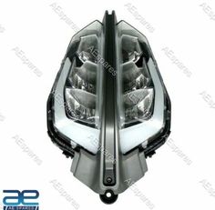 an image of the front headlight of a car with its lights turned on and it is