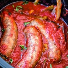 several sausages are cooked in a crock pot