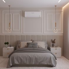 a large bed sitting in a bedroom next to two nightstands and a wall mounted air conditioner