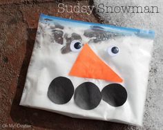 a paper bag with a snowman face on it