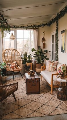 a living room filled with furniture and plants