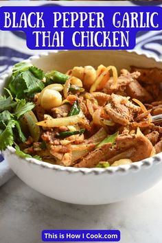 a white bowl filled with black pepper garlic thai chicken and garnished with cilantro