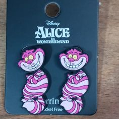 two pink and white cartoon character earrings