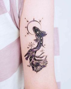 a woman's arm with a tattoo design on the left side of her body