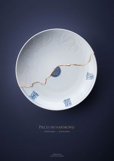 a white plate with blue designs on it and the words pieces in harmony written below