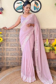 This pastel pink georgette saree will make you classy..This u neck and sleeveless blouse is highlighted with resham thread and sequins work.It is set together with georgette lightweight saree in pastel pink color beautified with sequins, resham thread, and muqayyash work.This saree blouse can be customized up to the maximum size available in inches 58 around the bust. Slight color variation may occur due to photographic reasons. Pink Georgette Saree, Embellished Saree, Pastel Pink Color, Georgette Blouse, Georgette Saree, Georgette Fabric, Lavender Color, U Neck, Georgette Sarees