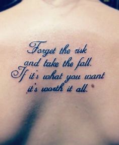 the back of a woman's shoulder with a tattoo saying, forget the ink and take