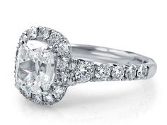 an oval cut diamond ring with pave set shoulders