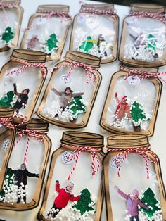 christmas ornaments in glass jars on a table