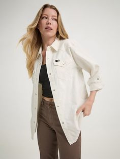 When cooler weather’s here to stay, you’ll want to wear our Women’s Corduroy Boyfriend Shirt every day. Offering a feminine take on the classic but looser look, this long-sleeve collared shirt is perfect for fall layering. It’s crafted for comfort from a soft corduroy fabric and finished with all the iconic Wrangler® details: Western-inspired yokes from front to back, chest pockets with flaps and the signature “W” embroidery, as well as a full pearl snap closure. Casual Cotton Outerwear For Rodeo, Denim Jacket Sherpa, Wrangler Women, Wrangler Pants, Destructed Jeans, Fall Layering, Loose Fit Jeans, Tall Jeans, Corduroy Fabric