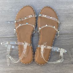 Falls Creek Sandal, New With Hangtag Missing, Still Has Plastic On It Has Silver Studs And Clear Straps On Tan Backdrop, Buckle Closure Very Popular Style Bundle From Our Huge Closet To Save On Shipping! Y1-5 Ab1 Sjmm 329023 Beach Sandals With Clear Strap And Open Toe, Summer Sandals With Clear Strap And Open Toe, Summer Open Toe Sandals With Clear Strap, Casual Beach Sandals With Clear Strap, Summer Sandals With Clear Strap, Summer Flat Sandals With Clear Strap, Casual Sandals With Clear Strap And Round Toe, Beach Sandals With Clear Ankle Strap, Womens Strappy Sandals