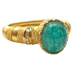 The Paraiba Tourmaline is the rarest gemstone in the jewelry world today. It is a copper-bearing tourmaline with the element turning it a wonderful shade of tropical blue. This fantastic ring was handmade by a family jeweler outside of Florence, Italy. The cabochon-cut tourmaline was hand-selected for this piece making it one-of-a-kind. It features scalloped detailing along the bezel and rich, silk lines carved individually into the shank. Set in solid, 18-karat yellow gold is one Paraiba Tourma Paraiba Tourmaline, Tropical Blue, Rare Gemstones, Florence Italy, Cocktail Rings, A Family, Florence, Tourmaline, Diamond Cuts