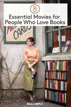 a woman standing in front of a library with bookshelves and a sign that reads liberia