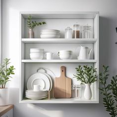 the shelves are filled with dishes and plants