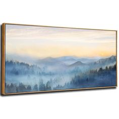 a painting with mountains and trees in the background is shown on a white wall, it appears to be foggy