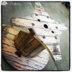 a wooden boat with holes in the side