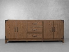 the sideboard is made out of wood and has metal handles on each side, along with drawers