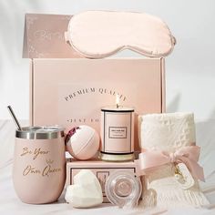 a pink box with some items in it and a sleeping mask on the top one