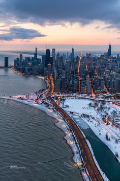 an aerial view of the chicago skyline in winter