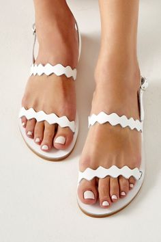 Adjustable White Slingback Sandals For Beach, Adjustable White Open Toe Slingback Sandals, White Adjustable Open Toe Slingback Sandals, Elegant White Slingback Sandals For Beach, White Toe Loop Sandals For Beach, White Leather Toe Ring Sandals With Single Strap, Adjustable White Barefoot Sandals, Adjustable White Leather Slingback Sandals, White Leather Toe Ring Sandals For Beach