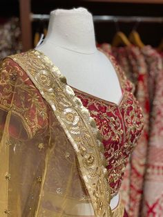 Ruby red gold floral embroidered border lace skirt paired with fully intricate zardozi, stone and thread work blouse and contrasting gold net dupatta. Fabric: Raw Silk This outfit can be customized in multiple colors and specific to client measurements. 90 days of production time is required and are for bulk orders only! Orders are processed in store only! Final fittings/alterations not included. Minimum Order Quantity- 4 pieces Gold Raw Silk Choli With Intricate Embroidery, Gold Silk Thread Sets With Dupatta, Gold Silk Dupatta Set, Raw Silk Dupatta With Gold Embroidery For Festivals, Bollywood Raw Silk Dupatta With Gold Embroidery, Traditional Art Silk Dupatta With Gold Embroidery, Designer Gold Lehenga With Sheer Dupatta, Designer Gold Saree With Intricate Embroidery, Gold Bollywood Choli With Intricate Embroidery