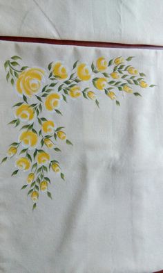 yellow flowers on white linen with red trim