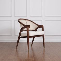 a white chair sitting on top of a hard wood floor