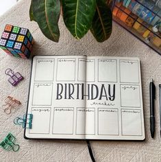 a notebook with the words birthday written on it next to some rubs and pens