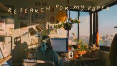 a person sitting at a desk in front of a window with the words research formmy paper on it