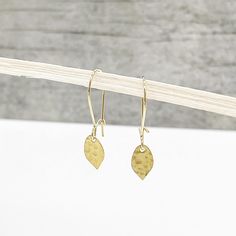 "Sweet Textured Teardrop Earrings in Brass Gold. Dainty Drop Earrings. Simple Gold Teardrop Earrings This pair reflects a contemporary yet timeless aesthetic that is equal parts simple, feminine, and oh-so-wearable. MATERIAL: Gold plated brass CLOSURE: Gold plated leverback LENGTH: 1\" long Questions? Please don't hesitate to start a convo, we'd love to hear from you! WELCOME! Welcome to Rustic Gem Jewelry! Thank you for visiting our shop. We take custom orders and can often do a similar piece i Adjustable Drop Earrings In Dainty Style, Delicate Dangle Earrings With French Hook, Adjustable Dainty Drop Earrings, Dainty Teardrop French Hook Earrings, Gold Teardrop Earrings, Drop Earrings Simple, Gem Jewelry, Glass Drop Earrings, Timeless Aesthetic