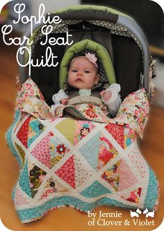 a baby in a car seat with a quilt on it's back and the cover is