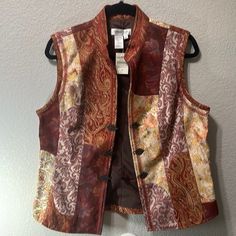 New Coldwater Creek Fall Rust Brocade Vest | Antique Brass Clasp| Size Medium Condition: New W/Tags (Nwt) New To Poshmark? Get $10 Off Your First Purchase When You Use Code: Texasdrawers Shipping- 24 To 48 Hours Smoke/Pet Free Home 5 Star Seller Tags: Preowned , Used , Versatile, Transitional, Universal, Everyday, Casual, Classic, Timeless, Neutral, Holiday, Birthday, Christmas, Xmas, Staple, Utility, Loungewear, Functional, Work, Capsule, Gift, Buttery, Soft, Cozy, Light, Core, Dressy, Modest, Fitted Patchwork Vest For Fall, Fitted Patchwork Vest For Spring, Fitted Multicolor Vest For Fall, Brocade Vest, Preppy Travel, Work Capsule, Coldwater Creek, Holiday Birthday, Antique Brass