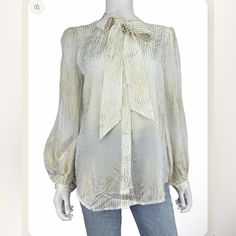 New With Tags, Long-Sleeve White And Gold Metallic Abstract Print Button-Down Blouse Featuring A Tie Neck. Brand = 7 For All Mankind Size = M Condition = New Level = Base Box #95 Faux Leather Vest, Color Block Shirts, Crochet Ruffle, Vest Crop Top, Women White Blouse, Gold Blouse, Ruffle Crop Top, Tie Neck Tops, Red Flannel