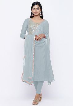 Chanderi Cotton Straight Kameez in Pastel Grey. This Readymade attire with Cotton Lining is Enhanced With Gota Patti, Zari, Bullion And Beads Work And is Crafted in Round Neck And Quarter Sleeve. Available with a Lycra Leggings in Pastel Grey and a Faux Chiffon Dupatta in Pastel Grey, For sizes 46 to 66, a Shantoon Churidar will be available instead of Leggings in the same color. The Kameez and Bottom Lengths are 45 and 45 inches respectively. Do Note: Accessories shown in the image are for pres Embellished Chanderi Churidar Straight Kurta, Fitted Long Sleeve Churidar With Gota Work, Festive Embellished Chanderi Churidar, Diwali Embellished Georgette Unstitched Suit, Fitted Embellished Straight Kurta, Embellished Fitted Straight Kurta, Embellished Straight Kurta Churidar For Festive Occasions, Festive Embellished Straight Kurta Churidar, Embellished Fitted Chanderi Kurta