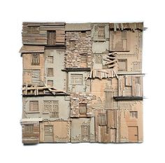 a piece of cardboard that is made to look like a building with windows and shutters