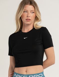 Nike Sportswear Essential Slim Crop Tee. Embroidered Nike Swoosh Logo On Center Chest. Ribbed Crew Neckline. Short Sleeve. Slim Fitting, Cropped Fit. 49% Polyester, 48% Modal, 3% Spandex. Machine Wash. Imported. Model Is Wearing A Size Small. Model Measurements:height: 5'8" Bust: 33"waist: 26"hips: 36 1/2" Sporty Workout T-shirt, Spring Gym T-shirt With Crew Neck, Nike Cropped Short Sleeve T-shirt For Sports, Spring Crew Neck Crop Top For Gym, Sporty Crew Neck Crop Top For Workout, Sporty Moisture-wicking Cropped T-shirt, Sports Cropped T-shirt With Moisture-wicking Stretch, Sporty Moisture-wicking Cropped T-shirt For Workout, Fitted Sportswear T-shirt For Sports Season