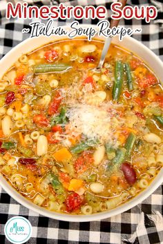 a white bowl filled with minestone soup on top of a checkered table cloth