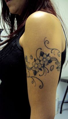 a woman with a tattoo on her arm