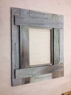 an old wooden frame hanging on the wall