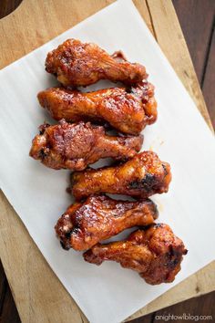 several pieces of chicken sitting on top of a piece of paper