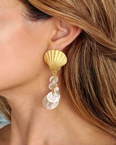 "Welcome to Mevissa! If you love unique handmade jewelry you have come to the right place! Our gorgeous Gold Dipped Seashell earrings feature scalloped shells with freshwater pearls.  The perfect way to add some summer flare to your look. One of a kind statement earrings made with love in Hawaii. **Please note that freshwater pearls may have small blemishes and inconsistencies upon inspection, they are each different by their nature. Product Details- Earring Length: Approximately 2.5\" Composition: Gold plated, freshwater pearls, MOP shell Weight: 16g (pair) We normally ship out our orders within 1-3 business days (not including weekends). A microfiber jewelry pouch and care card is included with each order. If you have any questions or comments please feel free to message us and we will r Cheap Chic Earrings For The Beach, Summer Beach Pearl Earrings Shell-shaped, Shell-shaped Pearl Earrings For Summer Beach, Summer Beach Shell-shaped Pearl Earrings, Beach Girl Aesthetic, Seashell Earrings, Scallop Shells, Summer Earring, Unique Handmade Jewelry